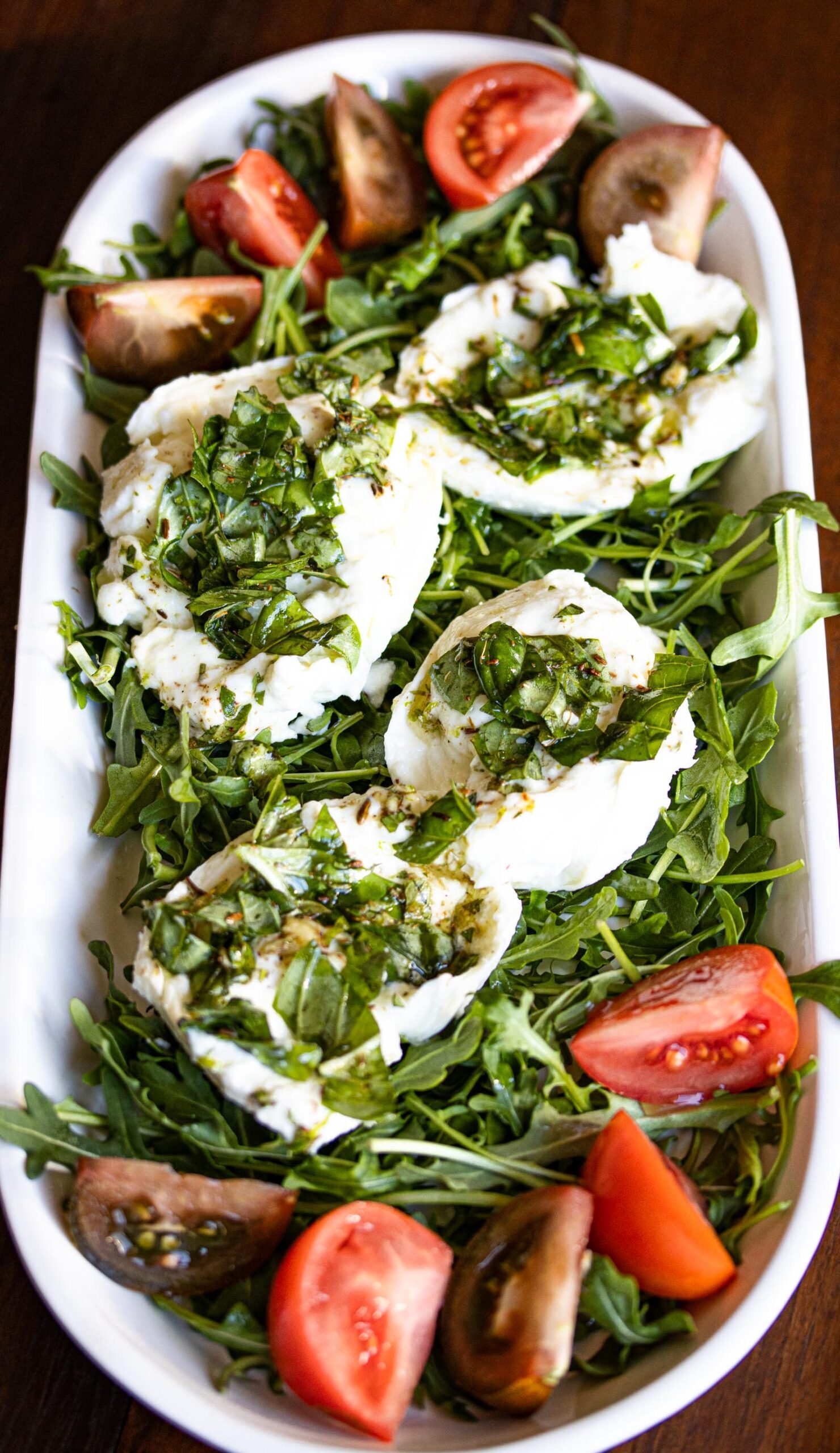 Buffalo mozzarella marinated, with tomatoes and arugula Buffalo mozzarella marinated, with tomatoes and arugula