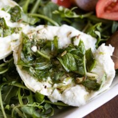 Buffalo mozzarella marinated, with tomatoes and arugula