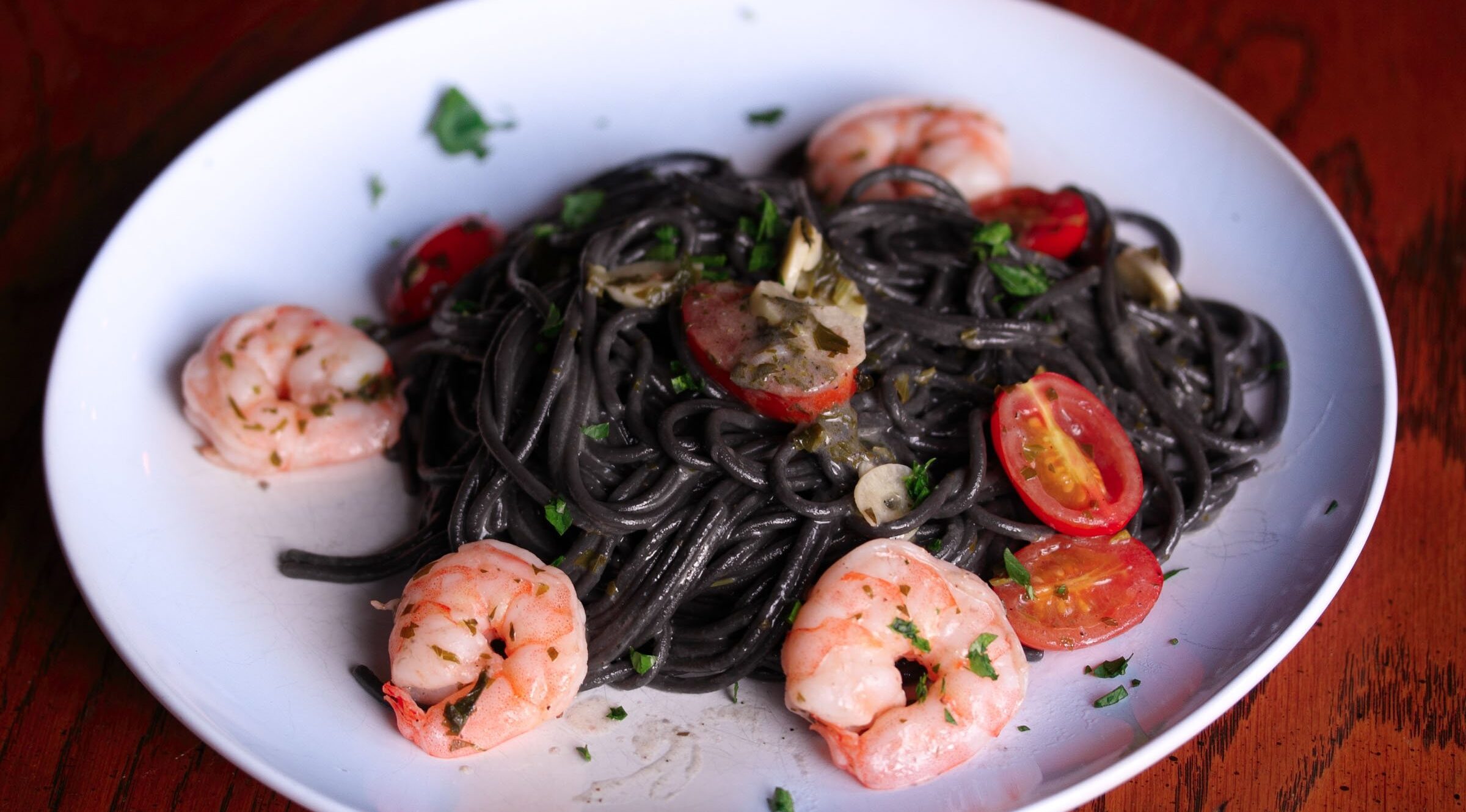 ink pasta with shrimps, tomatoes and garlic ink pasta with shrimps, tomatoes and garlic
