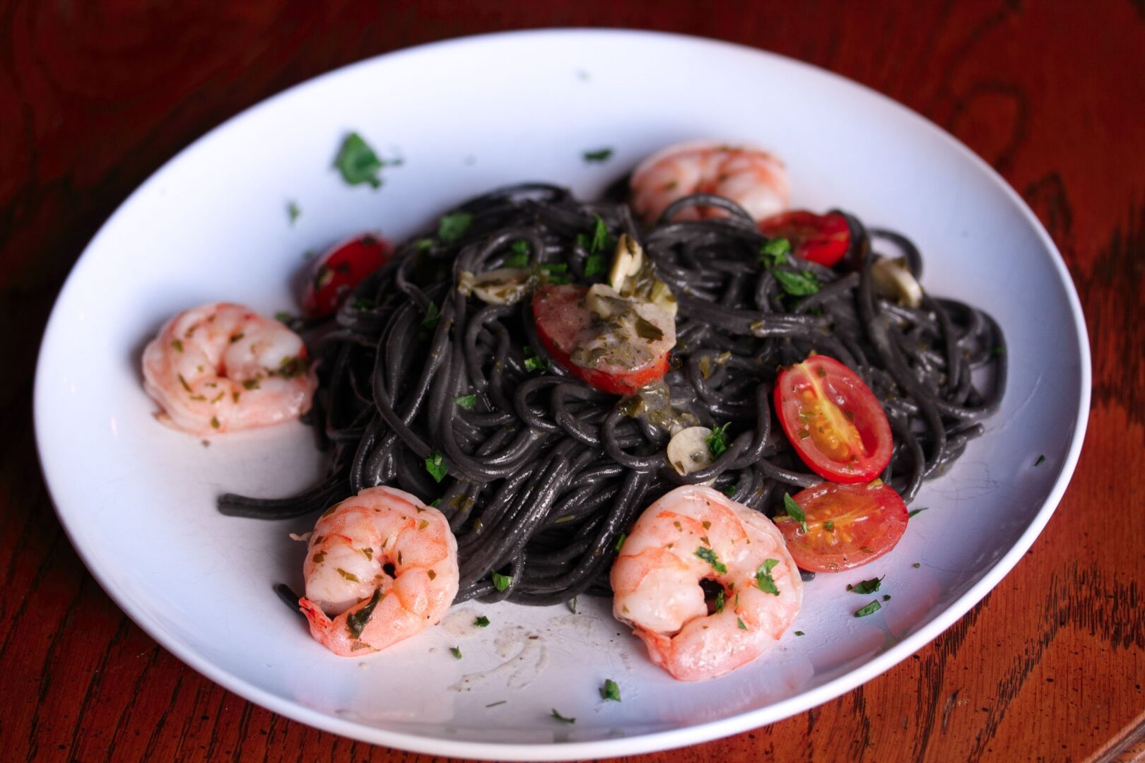 ink pasta with shrimps, tomatoes and garlic ink pasta with shrimps, tomatoes and garlic