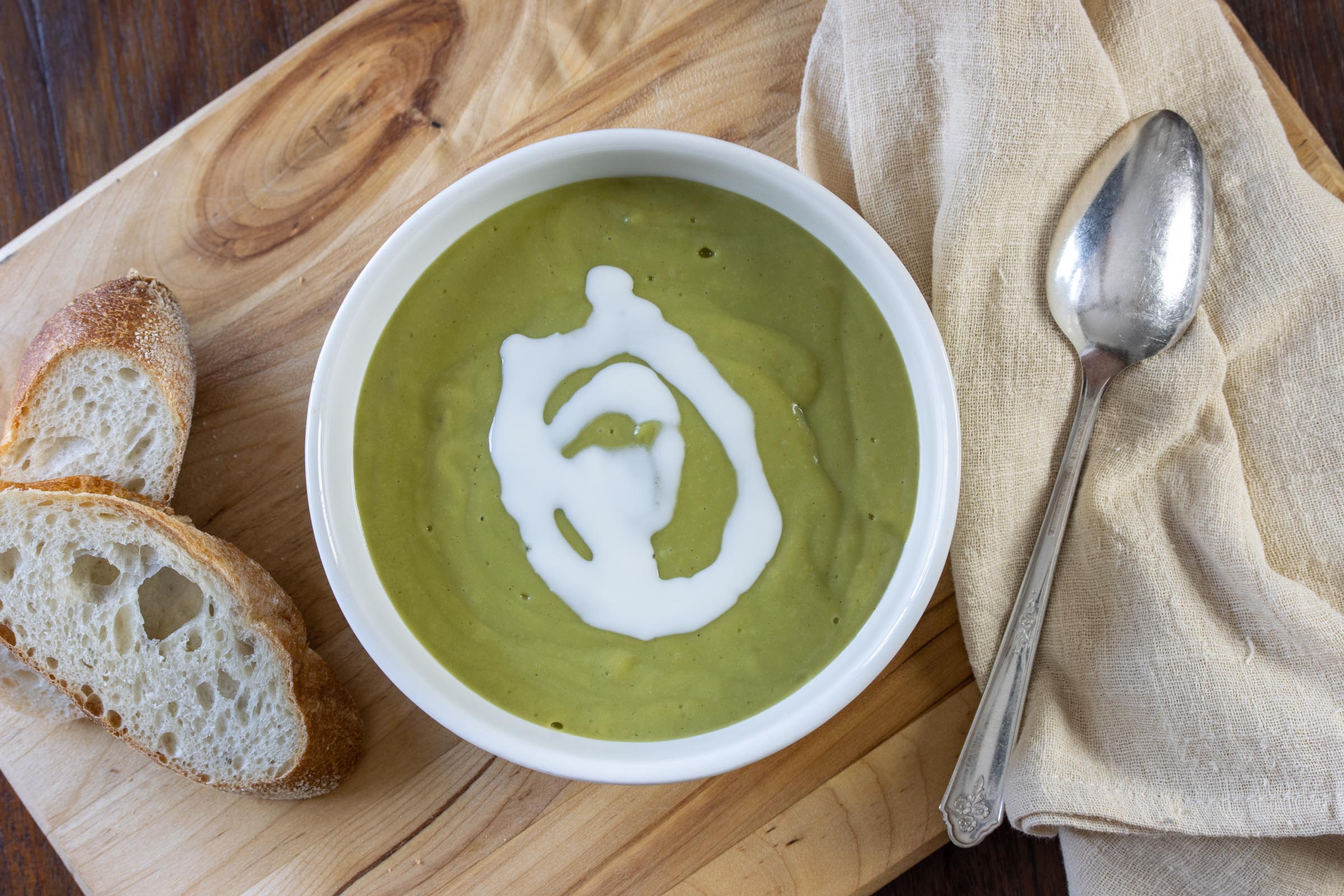 Creamy Watercress Soup Creamy Watercress Soup in a bowl with bread and a spoon