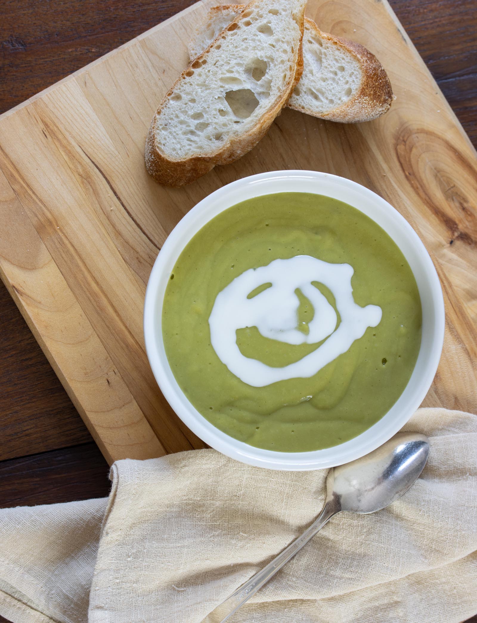 Creamy Watercress Soup Creamy Watercress Soup on as board served alongside bread, napkin and spoon